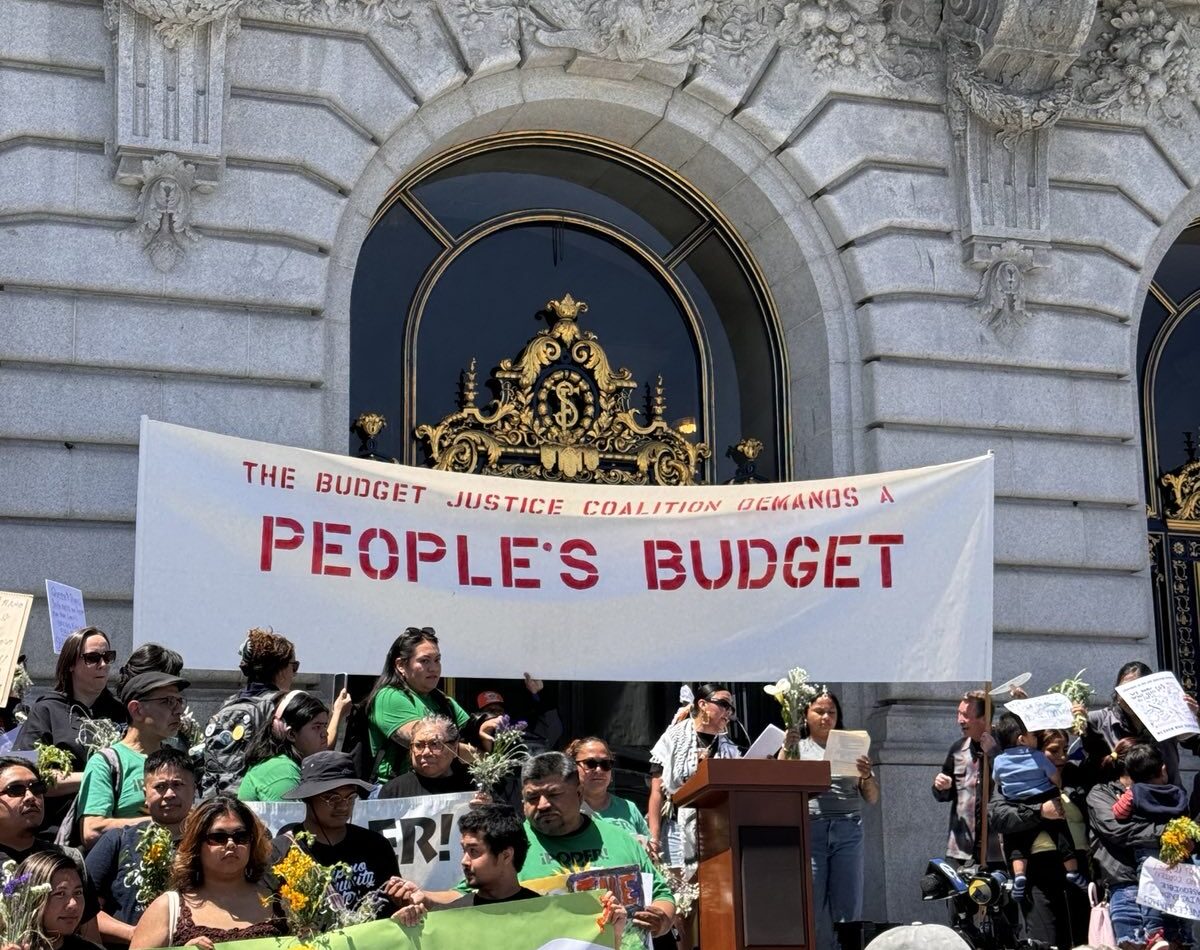 Workers in San Francisco rally against the budget cuts.